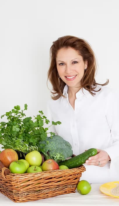 Cecilia with basket of produce